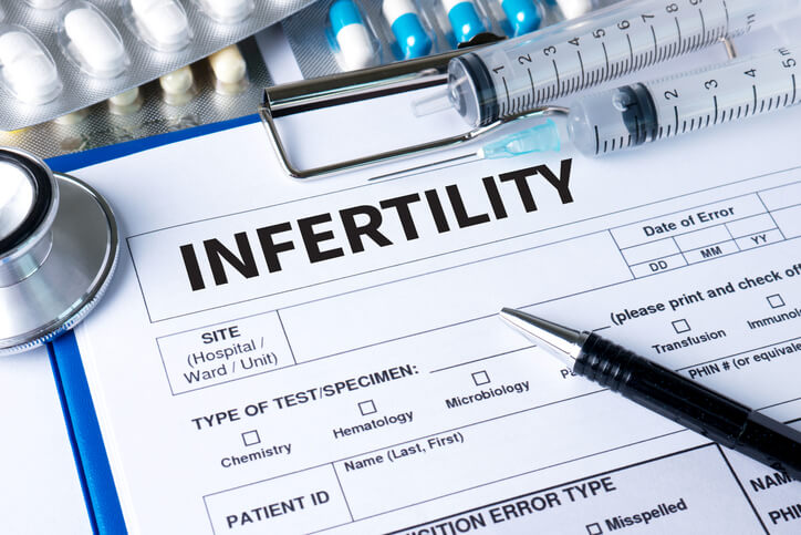 INFERTILITY couple giving a bribe for IVF treatment , Syringe and vaccine with drugs.