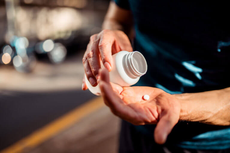 man taking pill for ED treatment