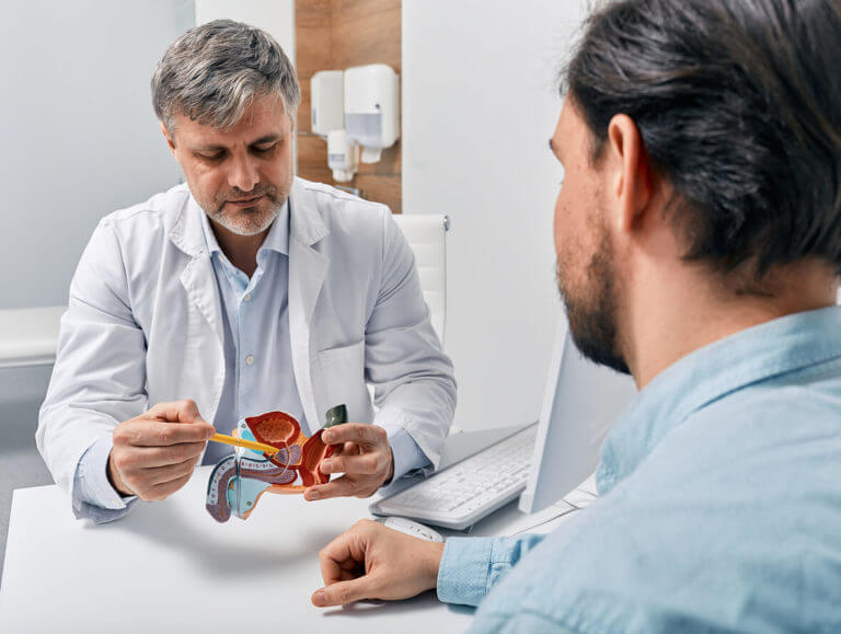 urologist consulting patient with prostatitis, explaining to him the vasectomy reversal procedure